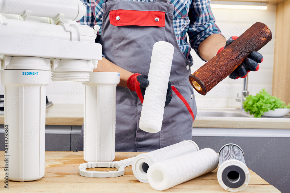 Inserting new RO filters into housing